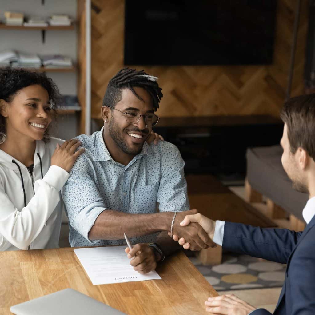 familyprotection couple shaking hands with mortgage broker