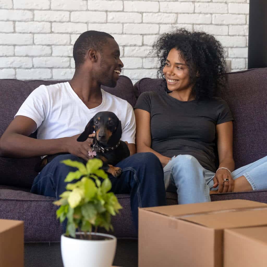 newhomes couple with sausage dog